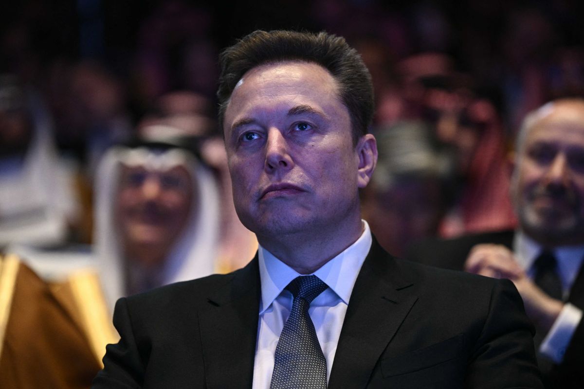 Elon Musk looks on as US President Donald Trump speaks at the US-Saudi Investment Forum at the John F. Kennedy Center for the Performing Arts in Washington, DC on November 19, 2025