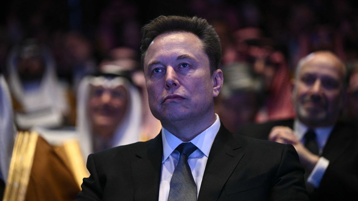 Elon Musk looks on as US President Donald Trump speaks at the US-Saudi Investment Forum at the John F. Kennedy Center for the Performing Arts in Washington, DC on November 19, 2025