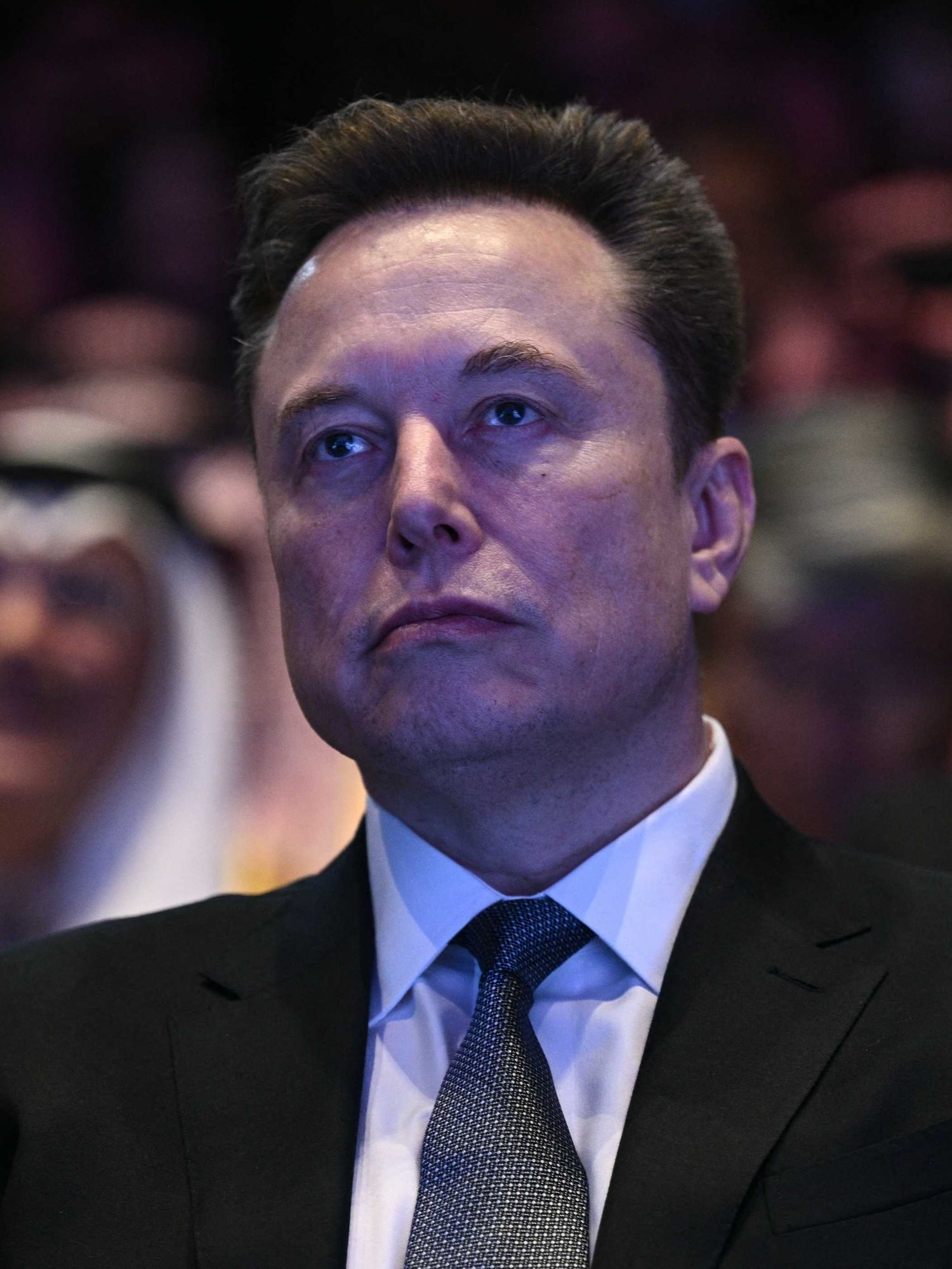 Elon Musk looks on as US President Donald Trump speaks at the US-Saudi Investment Forum at the John F. Kennedy Center for the Performing Arts in Washington, DC on November 19, 2025