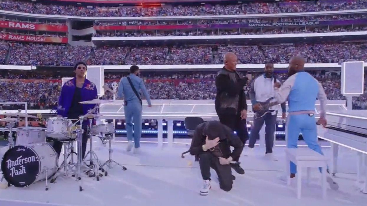 Eminem takes knee during Super Bowl halftime show performance
