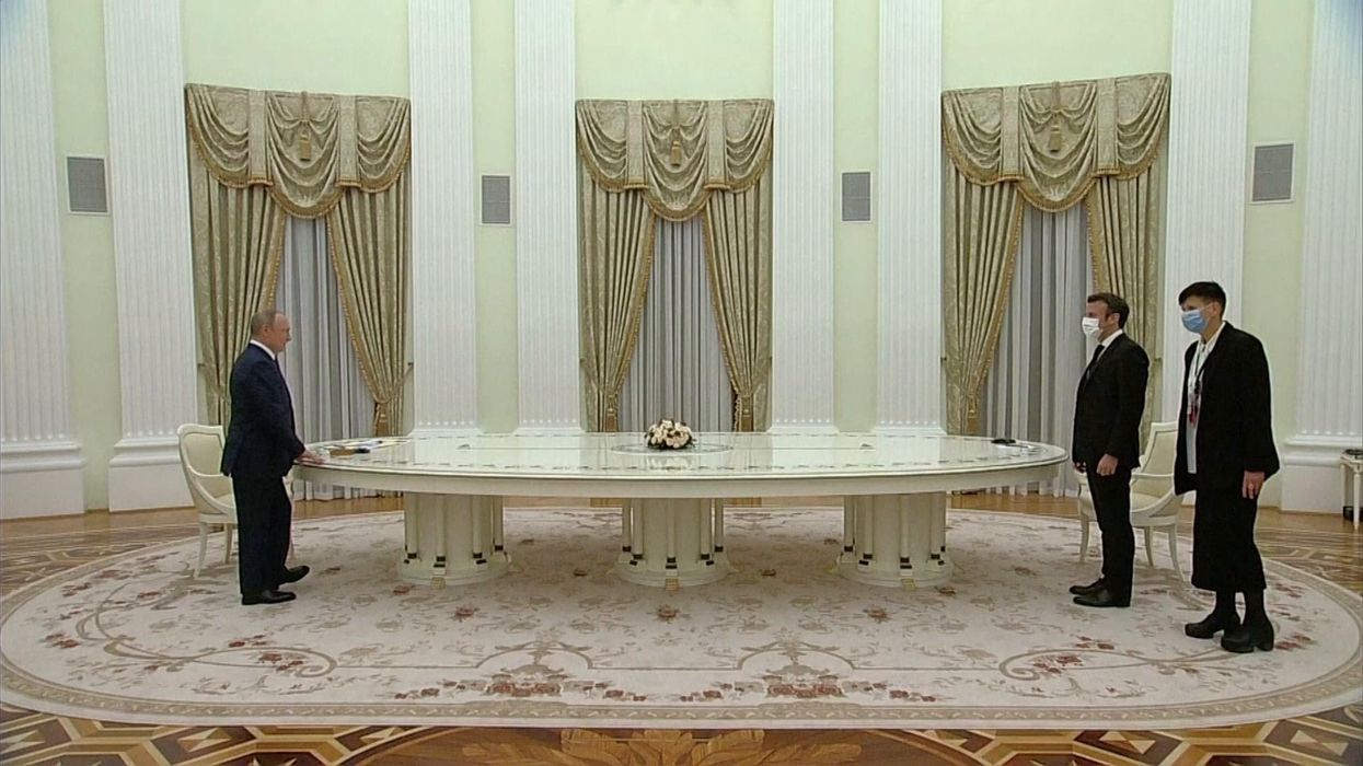 Putin and Macron's meeting on an enormous table has become an instant meme