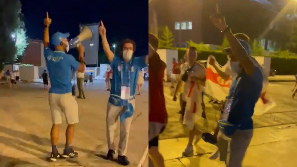 <p>England fans sing It's Coming Home with a steward after the Euro 2020 quarter-final in Rome</p>
