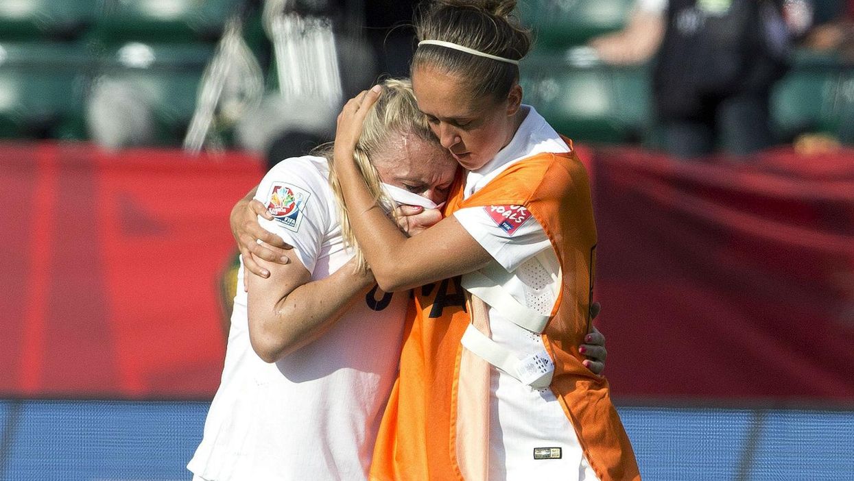 England's Laura Bassett is consoled by team-mate Jo Potter (Picture:) AP