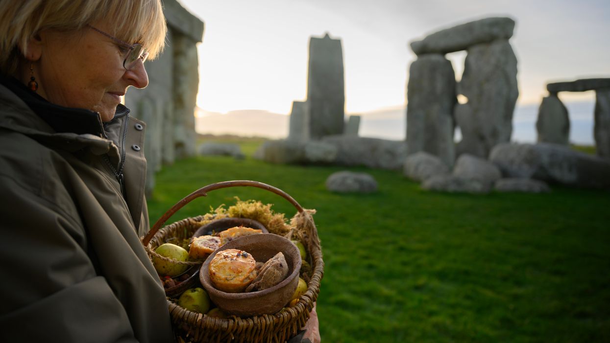 English Heritage volunteers are baking Neolithic inspired mince pies at Stonehenge (English Heritage/PA)