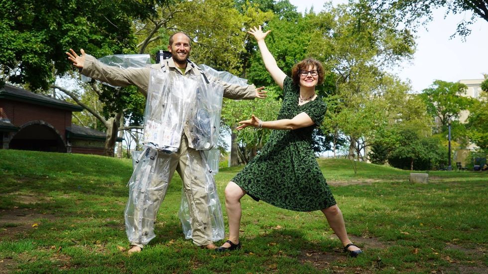 Environmentalist Rob Greenfield is pictured with Nancy Judd, the designer who created his custom-made suit that can hold up to 135 pounds of rubbish