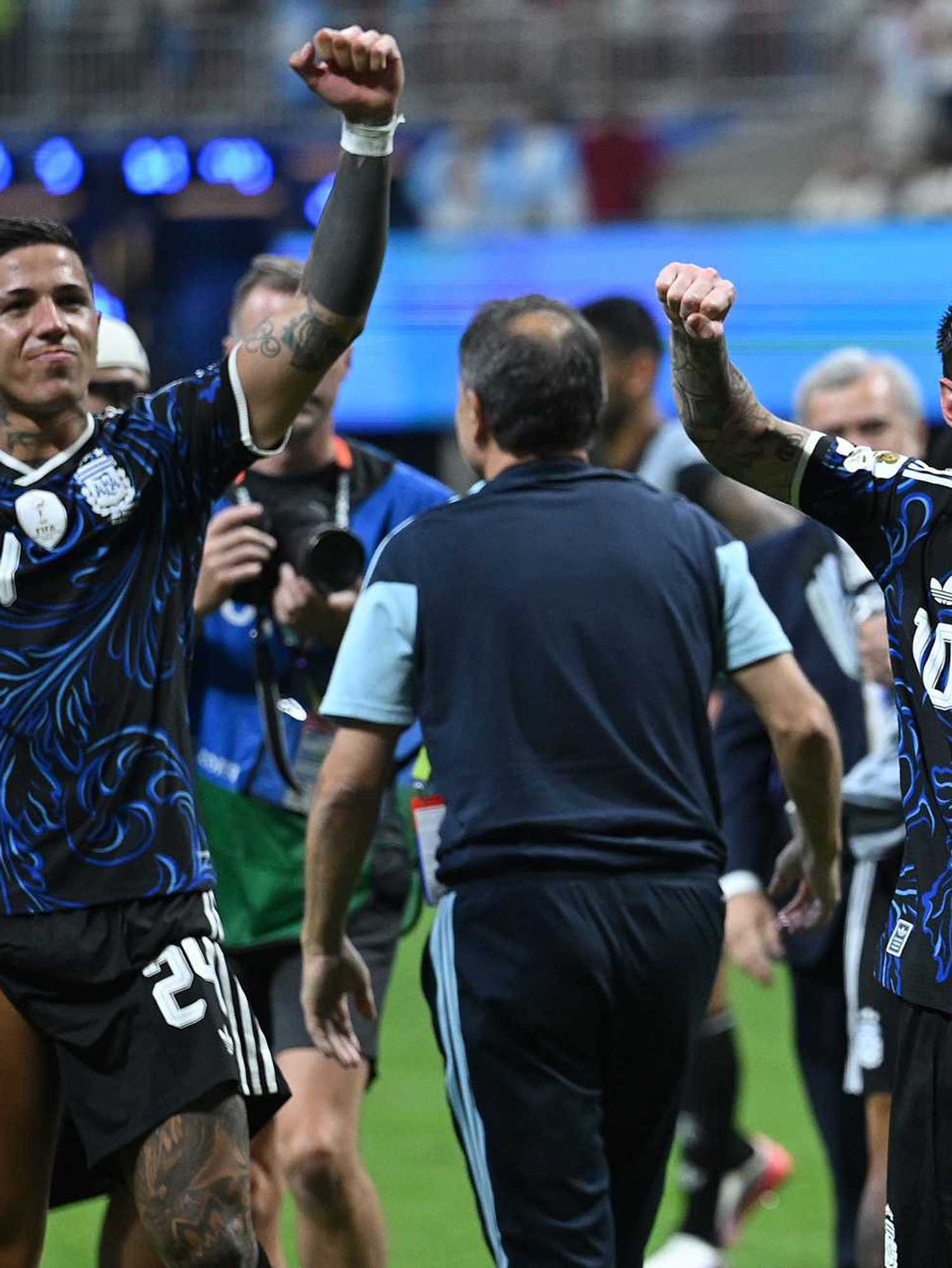 Enzo Fernandez #24 and Lionel Messi #10 of Argentina applaud fans after the 2-1 win during the FIFA World Cup 2026 Semi Final match between England and Argentina at Atlanta Stadium on July 15, 2026 in Atlanta, Georgia