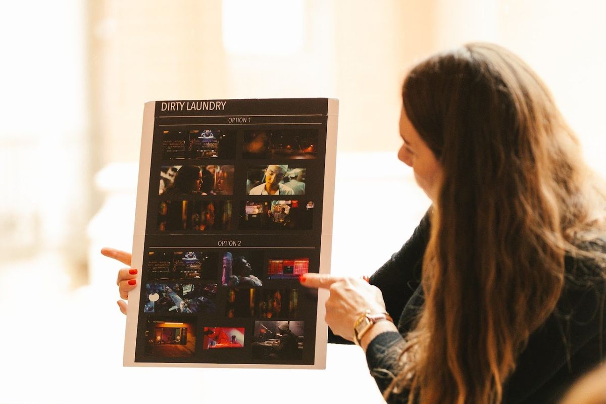 Erika showing a storyboard for their film 'Dirty Laundry'