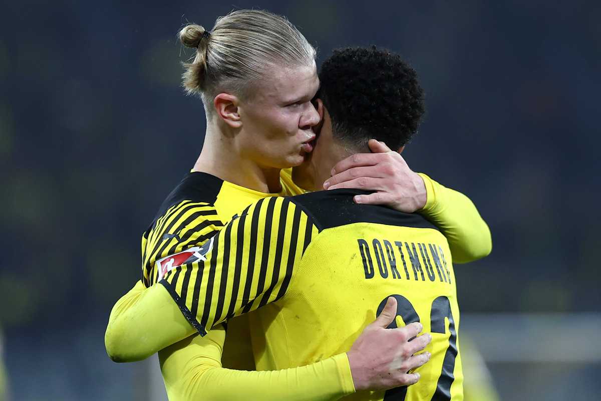 Erling Haaland of Borussia Dortmund celebrates scoring his teams first goal of the game with team mate Jude Bellingham by giving him a kiss during the Bundesliga match between Borussia Dortmund and SpVgg Greuther Fürth at Signal Iduna Park on December 15, 2021 in Dortmund, Germany