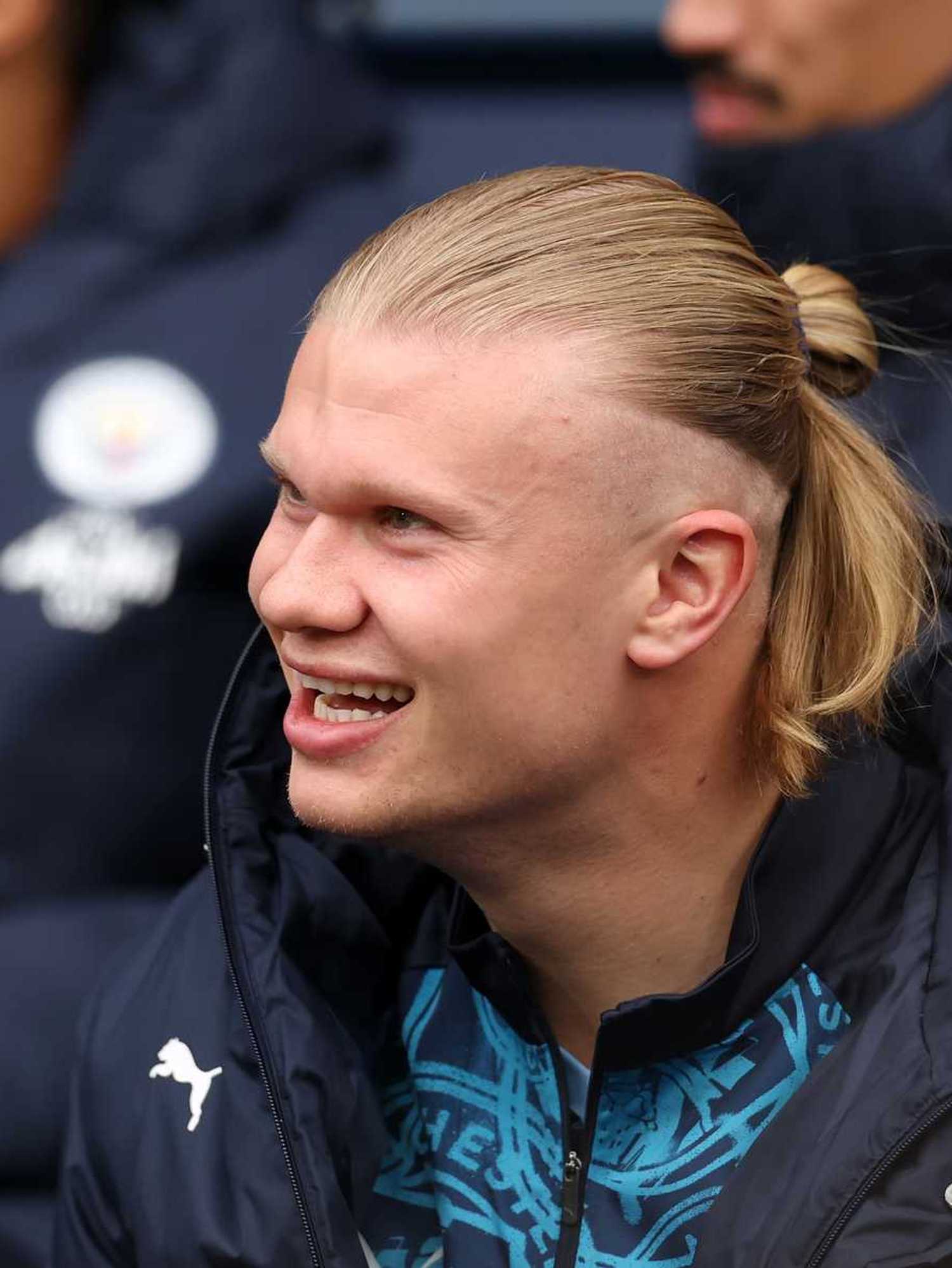 Erling Haaland of Manchester City laughs, as he looks on from the substitutes bench prior to the Premier League match between Manchester City and Crystal Palace at Etihad Stadium on May 13, 2026 in Manchester, England