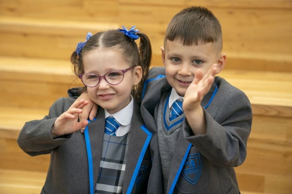 Eva-Grace and Greyson McNab embrace and wave