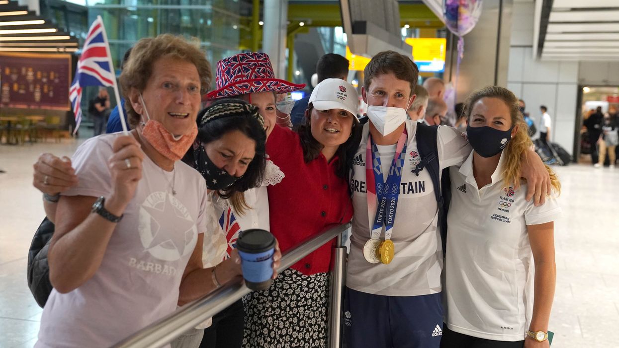 Event rider Tom McEwen arrives back at London Heathrow Airport (Steve Parsons/PA)