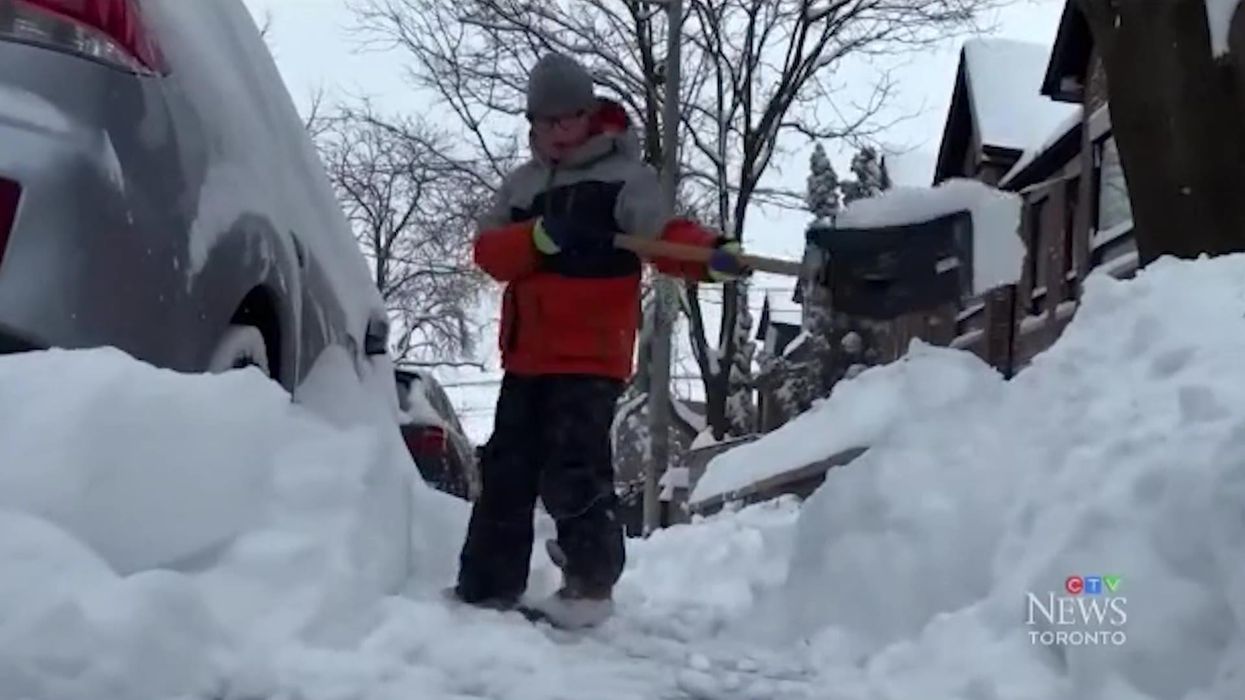 'Exhausted' nine-year-old boy tells news reporter he'd rather be at school than shovelling snow