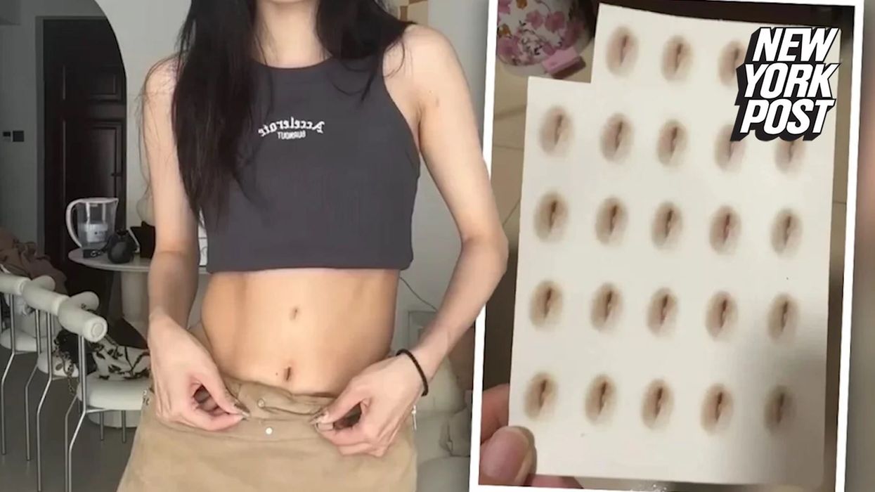 Woman who wants to appear taller gets a fake belly button tattoo