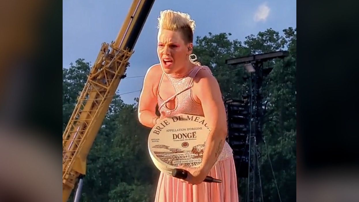 Pink being handed random objects has become an instant meme