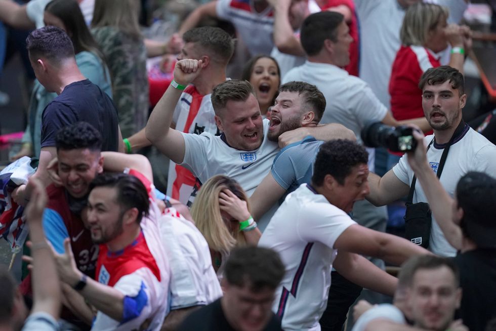 Fans in BoxPark Croydon celebrate Harry Maguire\u2019s goal