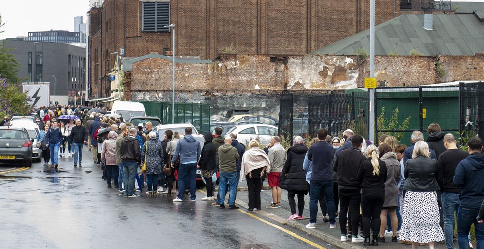 Fans queue around the O2 Apollo in Manchester (Peter Powell/PA)