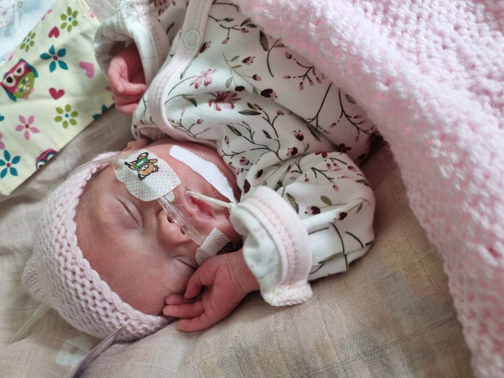 Fiadh at two months, wearing clothes for the first time