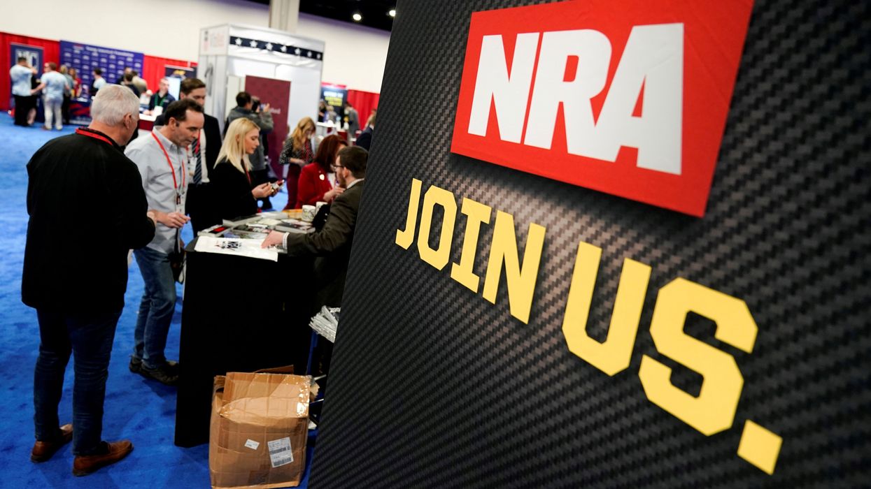 FILE PHOTO: Attendees sign up at the National Rifle Association booth at the Conservative Political Action Conference in Oxon Hill, Maryland