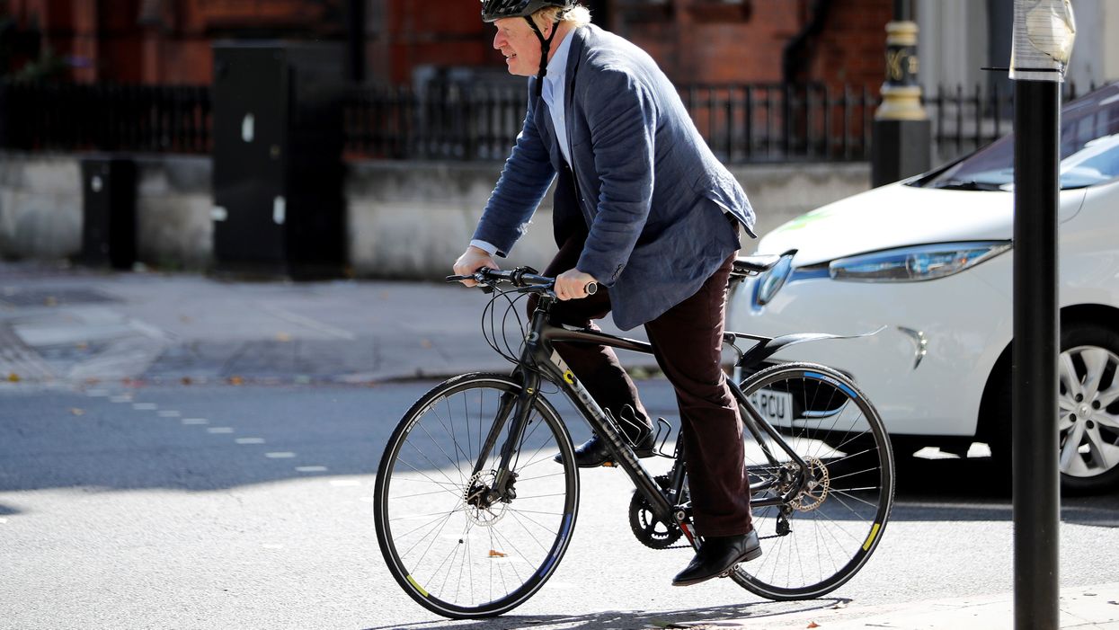 File photo of Boris Johnson on his bicycle 