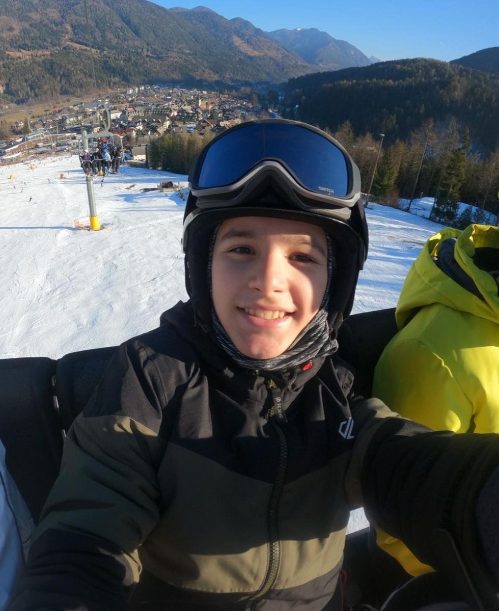 Teenager who broke back in sledging accident returns to the slopes