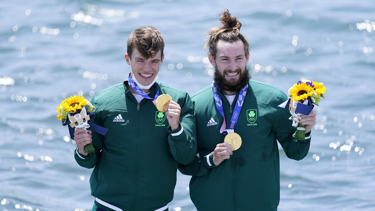 Fintan McCarthy and Paul O’Donovan on the podium following their Olympic win (Danny Lawson/PA)