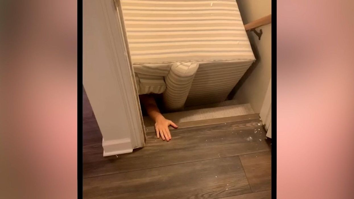 Homeowner furious at furniture company who left sofa wedged on the stairs