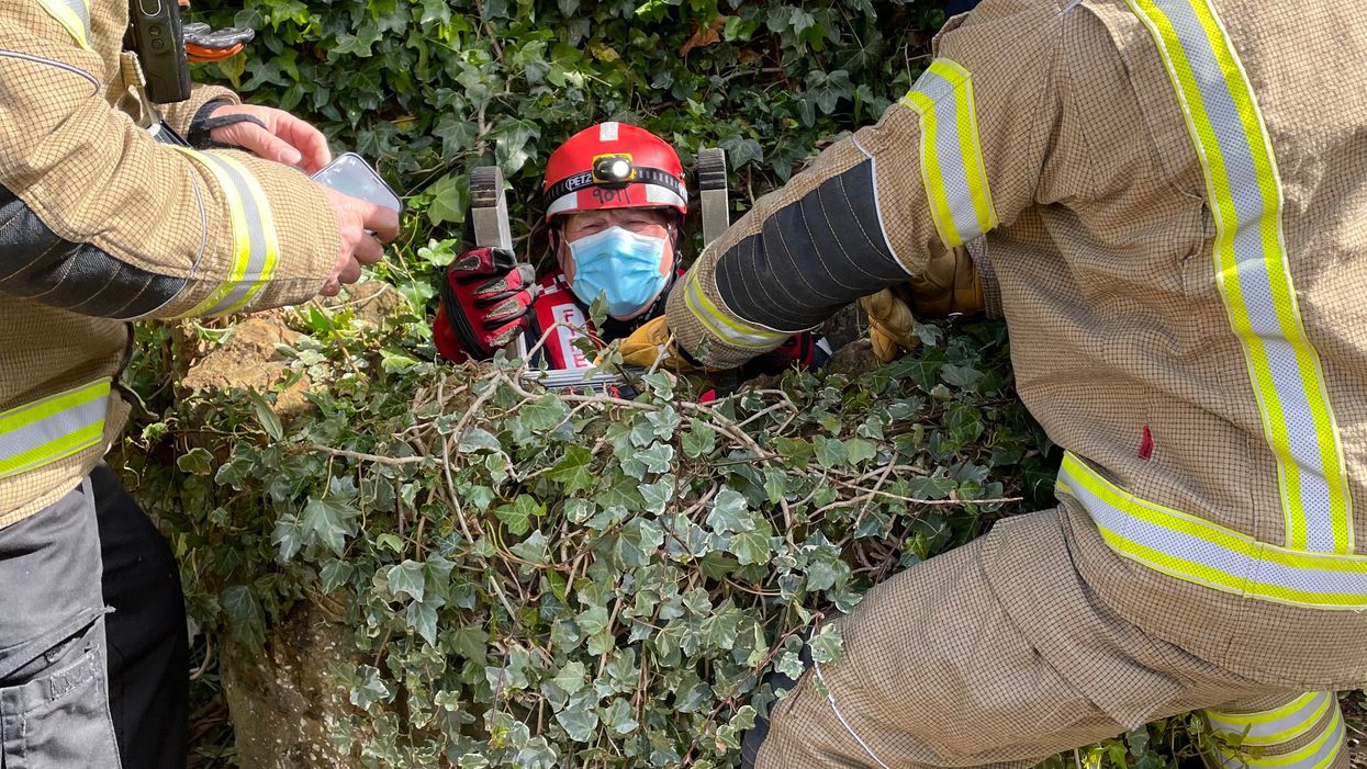 Firefighters rescue a cat from a well