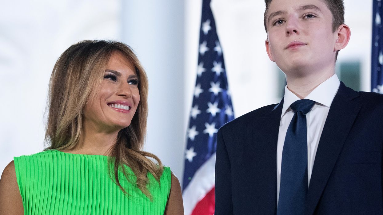 <p>First lady Melania Trump (L) looks at her son Barron Trump after U.S. President Donald Trump delivered his acceptance speech for the Republican presidential nomination on the South Lawn of the White House August 27, 2020 in Washington, DC. .</p>