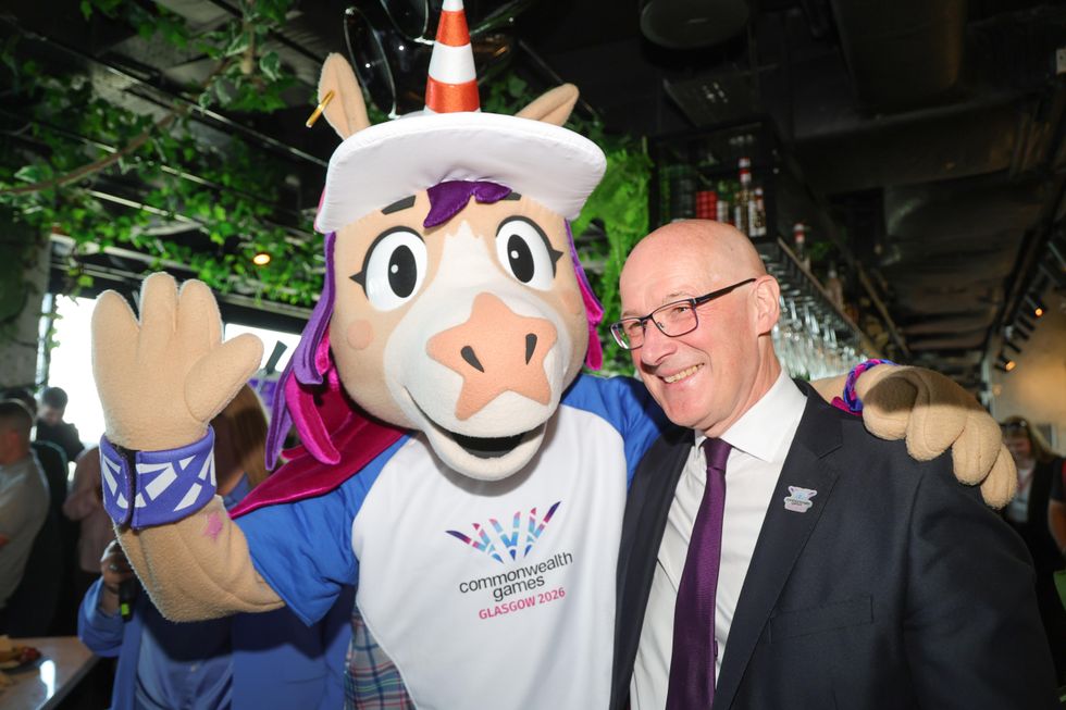First Minister John Swinney with Finnie, the Commonwealth Games' mascot