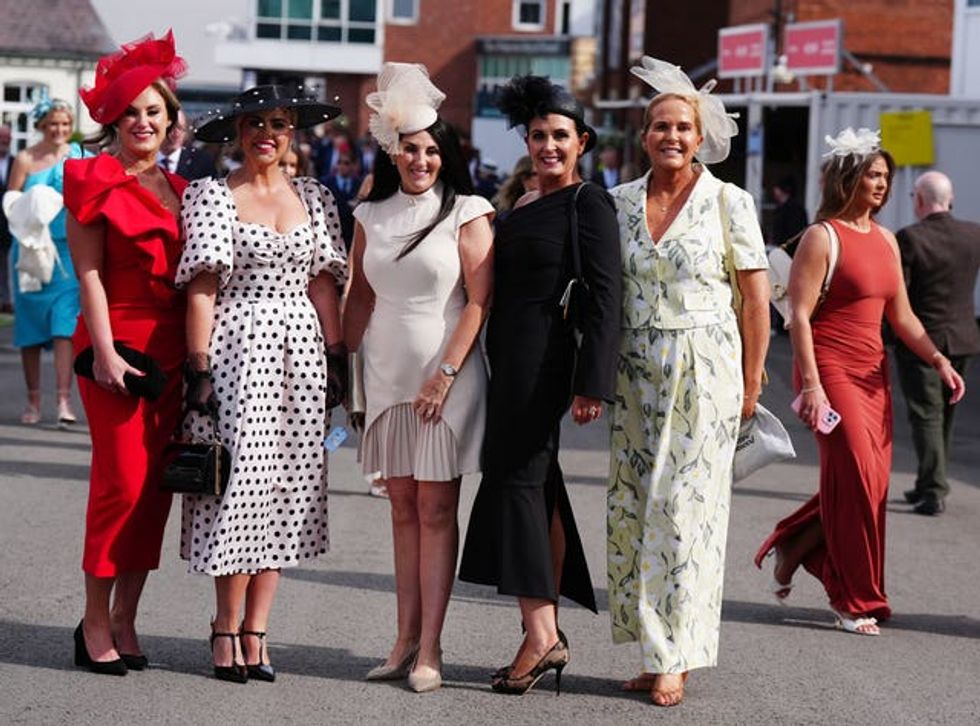 Five women in stylish dressers and hats