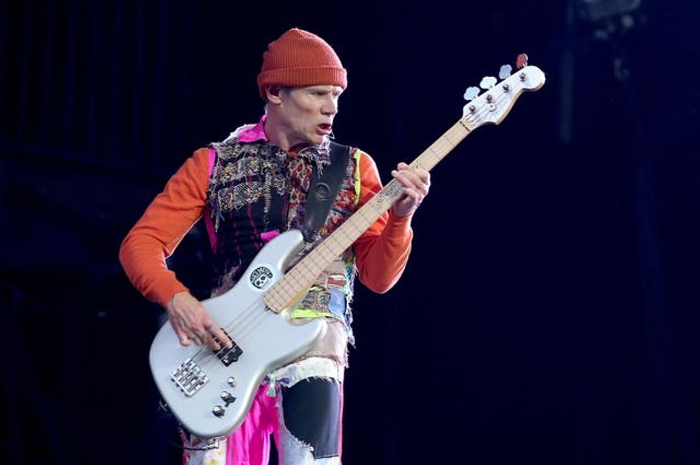 Flea playing guitar for the Red Hot Chili Peppers