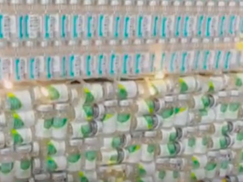 Flickering Christmas lights on the tree made from empty Covid and flu vials.