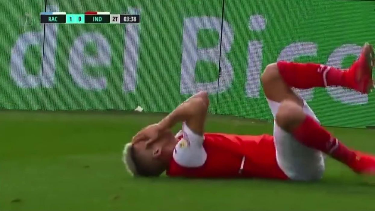 Footballer stretchered off field after being hit by fish thrown by rival fan