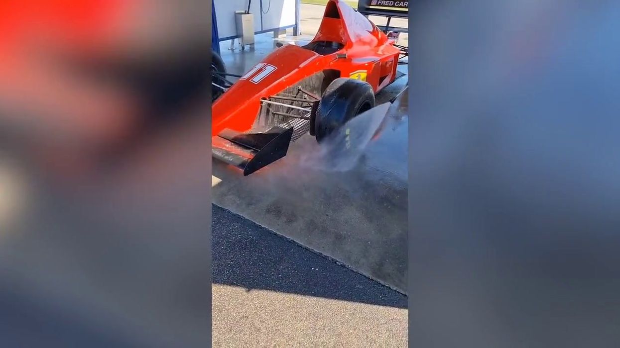 Formula One car pays unexpected visit to drive-thru car wash in France