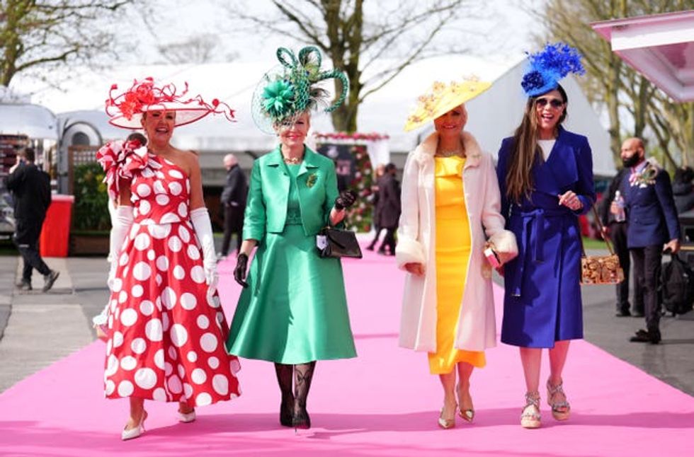 Four women in red, green, yellow and blue vintage looks