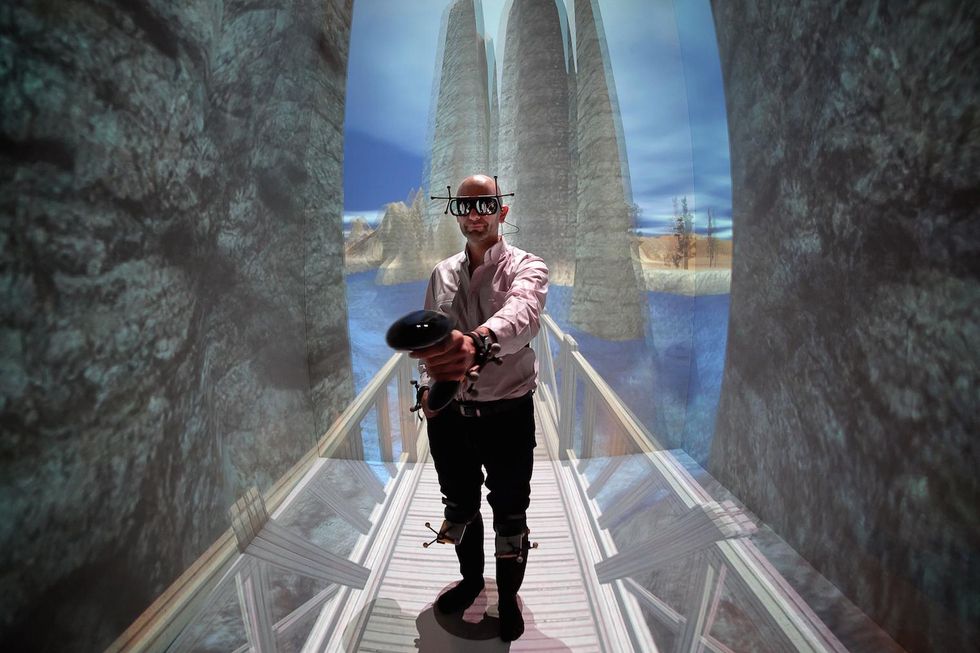 French patient Denis Duet wearing a virtual reality headset undergoes a VR therapy session