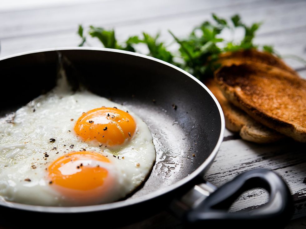 Fried eggs and toasted breads