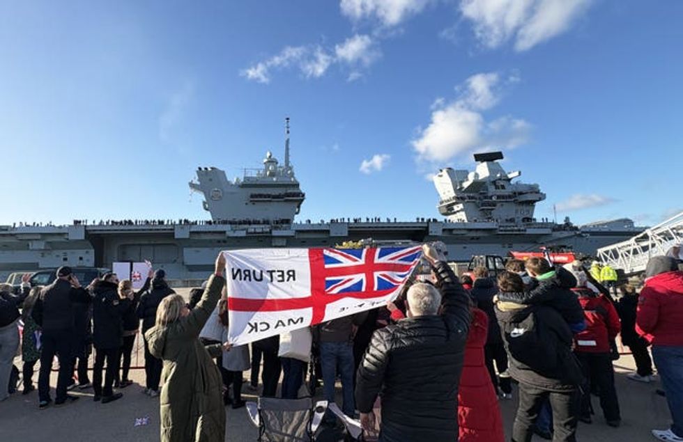 Friends and family wave as HMS Prince of Wales returns to Portsmouth