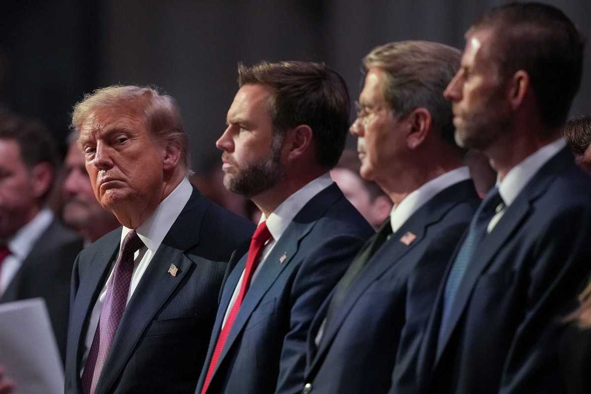 From left: Donald Trump, JD Vance, Scott Bessent and Eric Trump. They are all standing during a funeral.