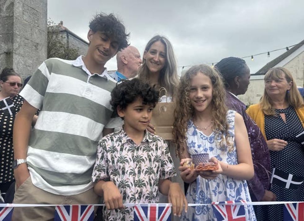 From left, Elijah Daka 15, Jedidiah Daka eight, their mother Sara and Eliana Daka, 11