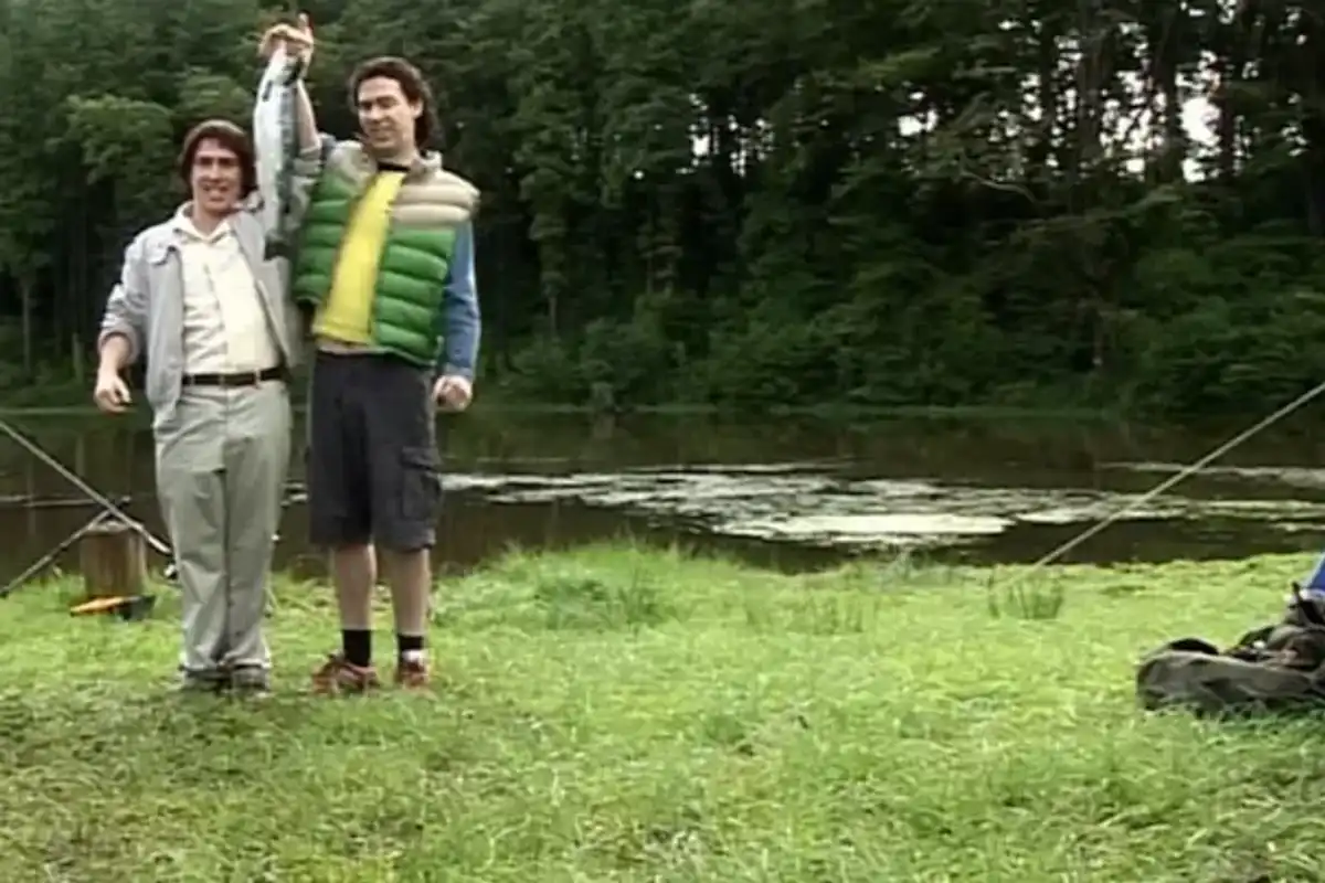 Gavin and Stacey characters Bryn and Jason proudly show off a fish they have caught by the lake