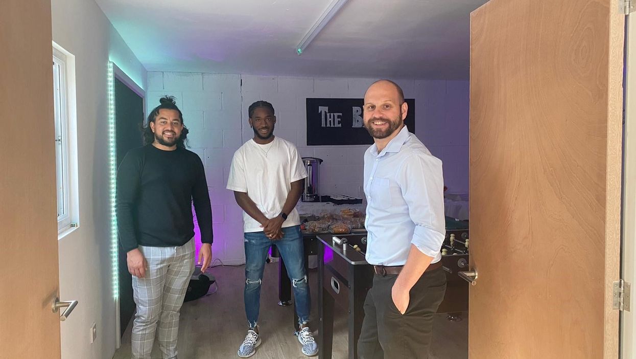 <p>Gavin McKenna with his staff, Aaron and Ben, at his venue</p>