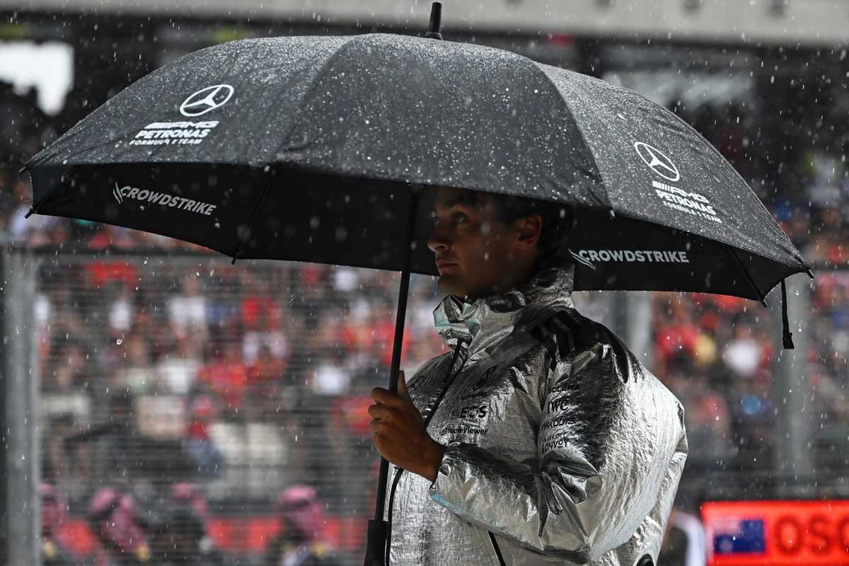 George Russell of Great Britain and Mercedes AMG Petronas F1 Team under an umbrella on the grid prior to the F1 Grand Prix of Bahrain in Malaysia at Sepang Circuit on October 04, 2026 in Kuala Lumpur, Malaysia
