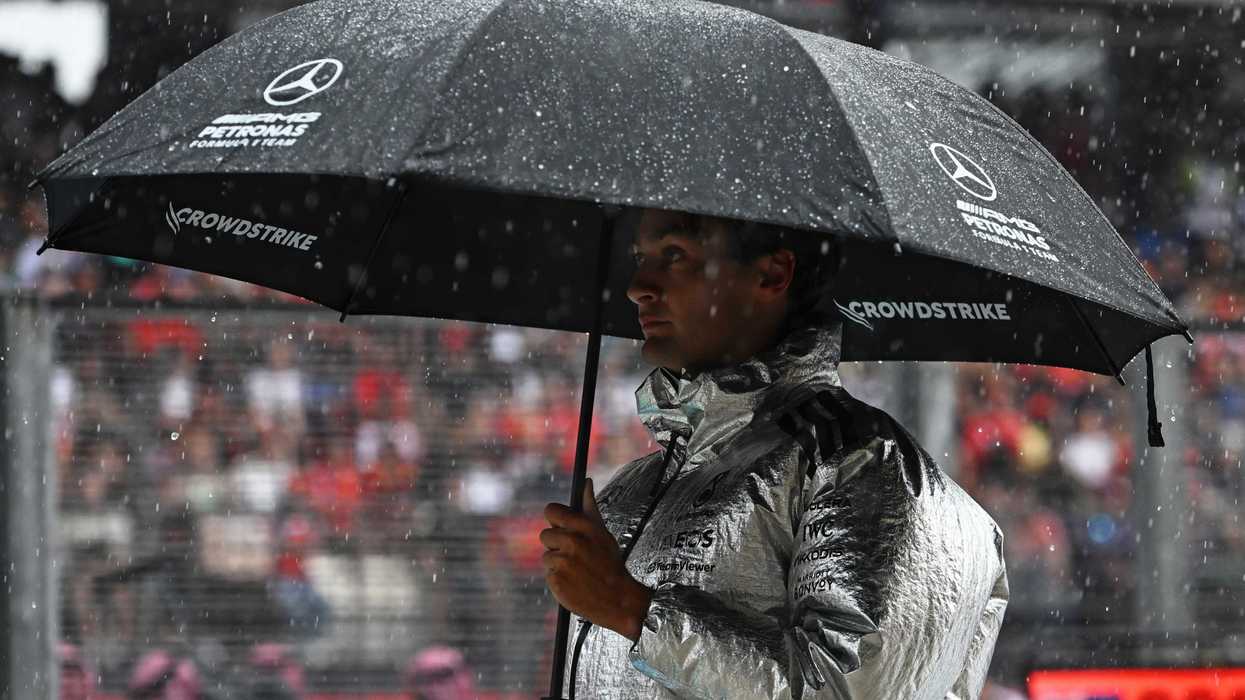 George Russell of Great Britain and Mercedes AMG Petronas F1 Team under an umbrella on the grid prior to the F1 Grand Prix of Bahrain in Malaysia at Sepang Circuit on October 04, 2026 in Kuala Lumpur, Malaysia