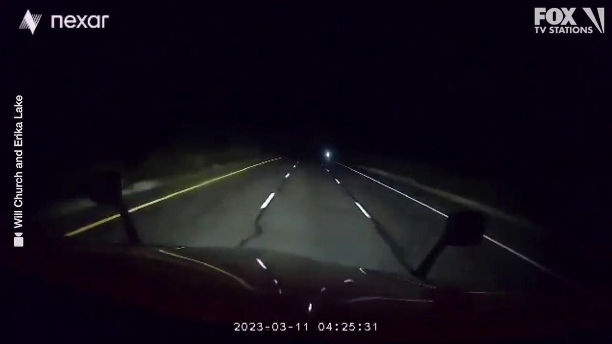 Trucker films creepy ghost-like figure on highway while driving alone