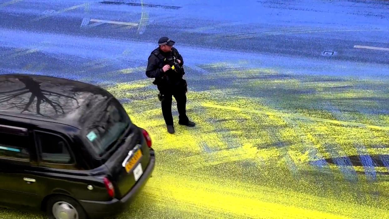 Huge Ukrainian flag painted outside Russian embassy in London by Led By Donkeys