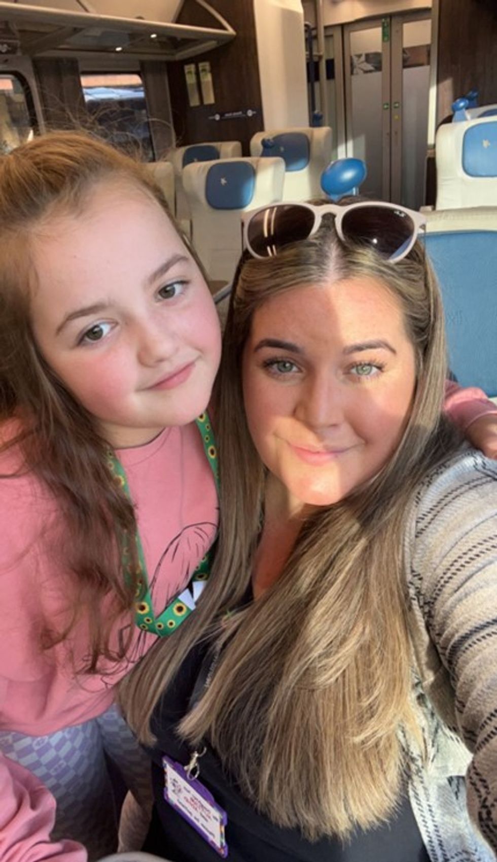 Girl and woman smiling together