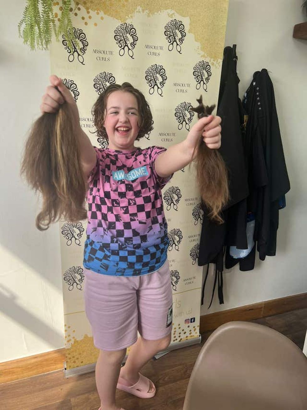 Girl holding bunches of hair
