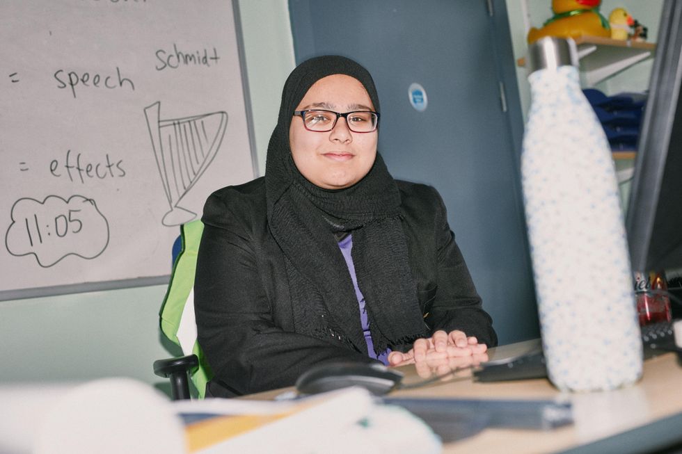 Girl sitting down and looking at the camera