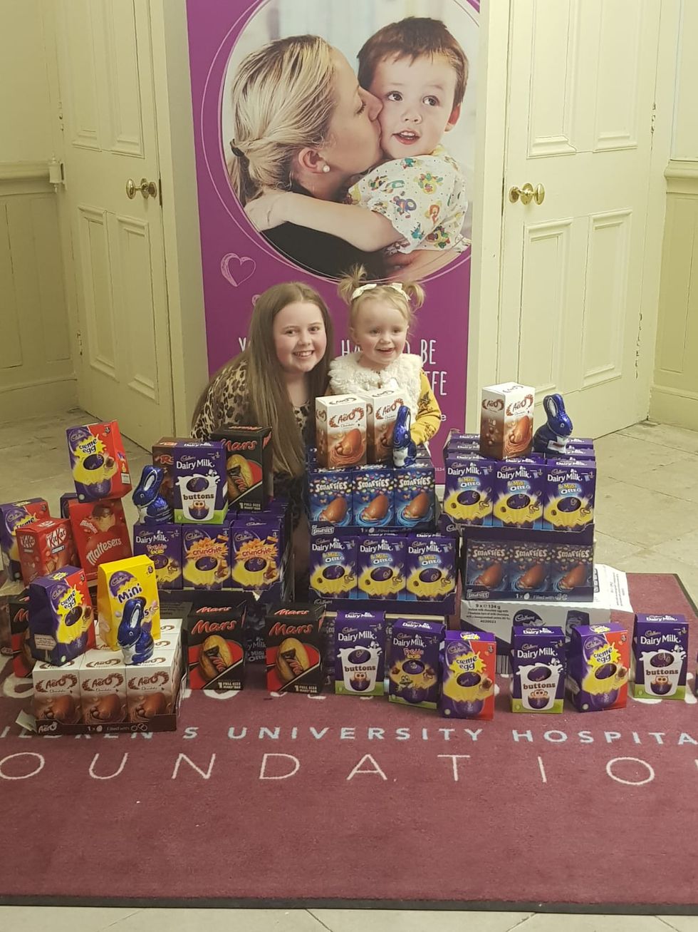 Girls on floor posing with eggs